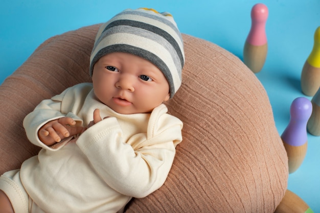 Free photo cute  baby doll for children still life