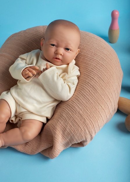 Free photo cute  baby doll for children still life