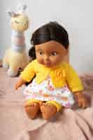 Free photo cute  baby doll for children still life