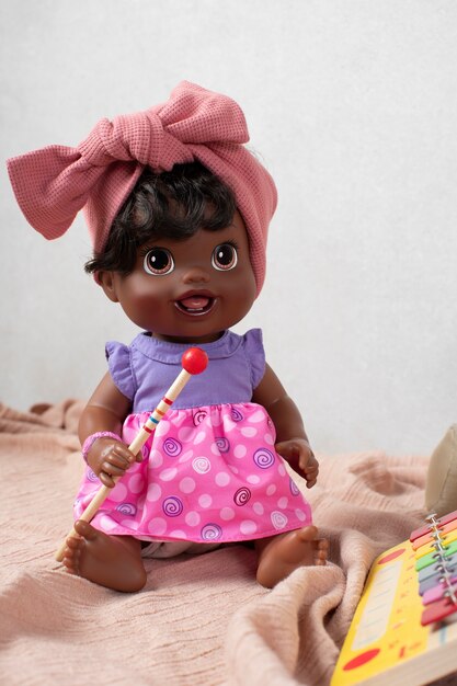 Free photo cute  baby doll for children still life