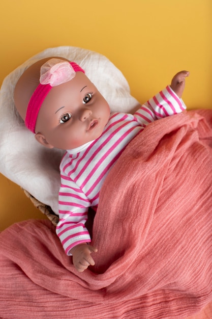 Free photo cute  baby doll for children still life