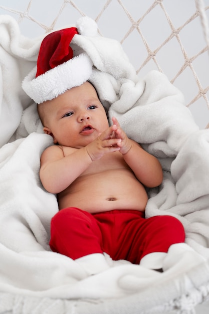 Cute baby dressed in santa claus clothing