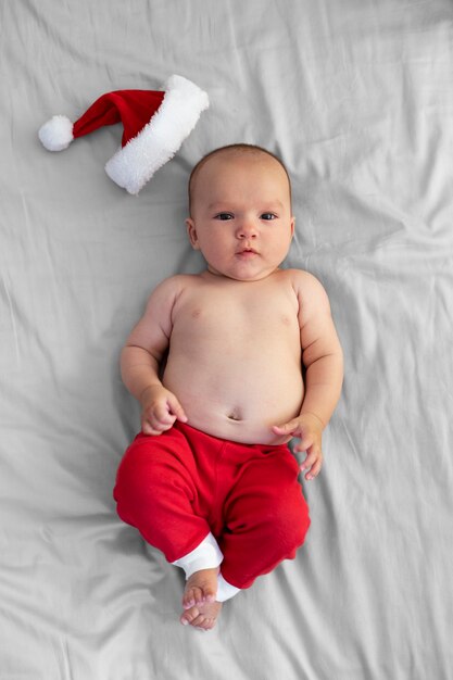 Cute baby dressed in santa claus clothing