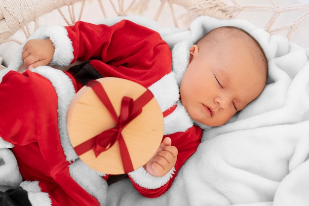 Cute baby dressed in santa claus clothing