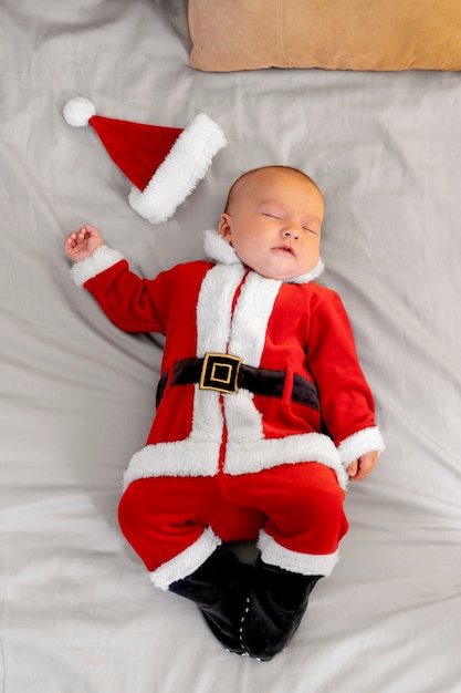 Cute baby dressed in santa claus clothing