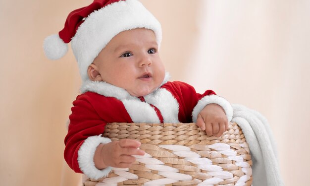 Cute baby dressed in santa claus clothing