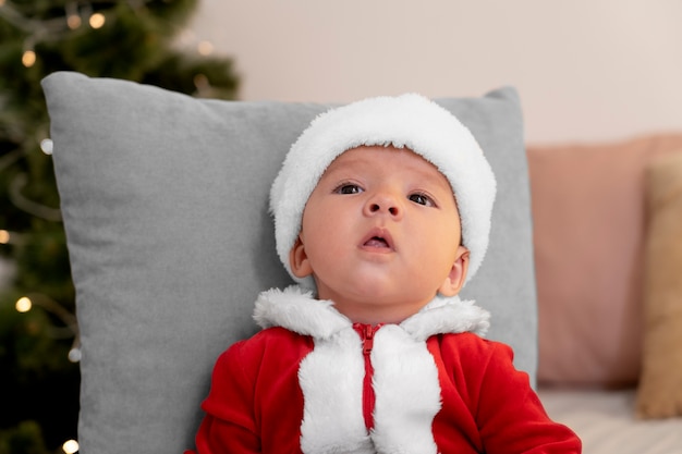 Cute baby dressed in santa claus clothing