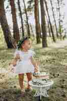 Free photo cute baby girl with her first birthday cake