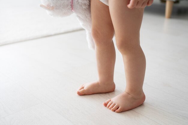 Cute baby going for their first steps