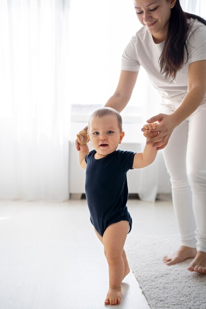 Cute baby going for their first steps