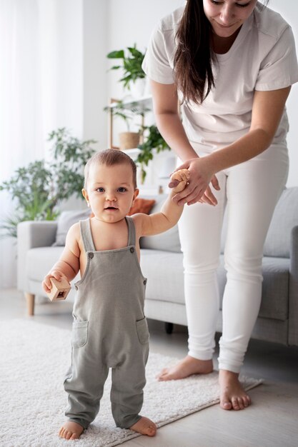 Cute baby going for their first steps