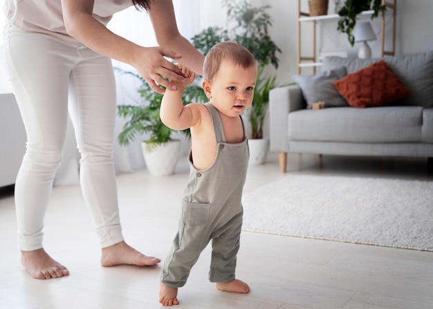 Cute baby going for their first steps