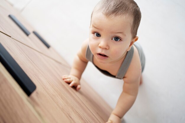 Cute baby going for their first steps