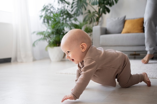 Cute baby going for their first steps