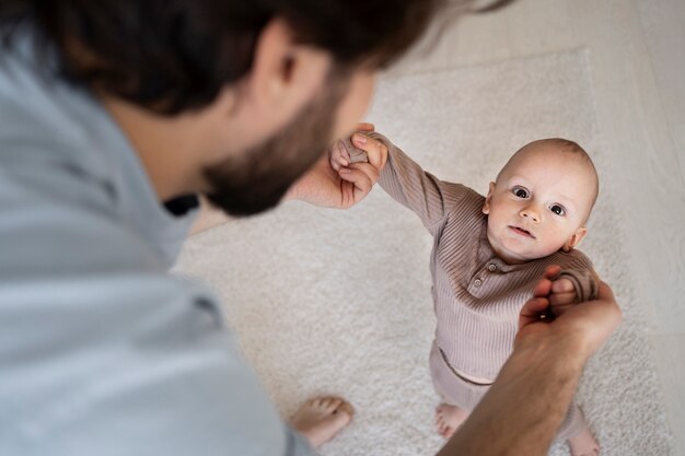 Cute baby going for their first steps