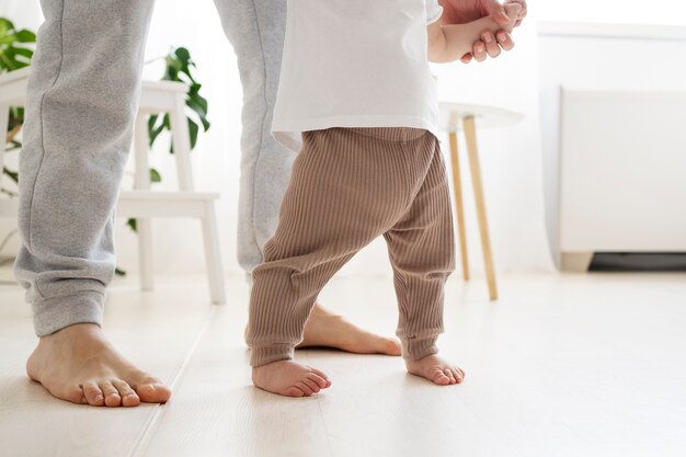 Cute baby going for their first steps