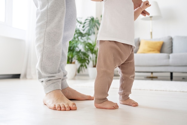 Cute baby going for their first steps