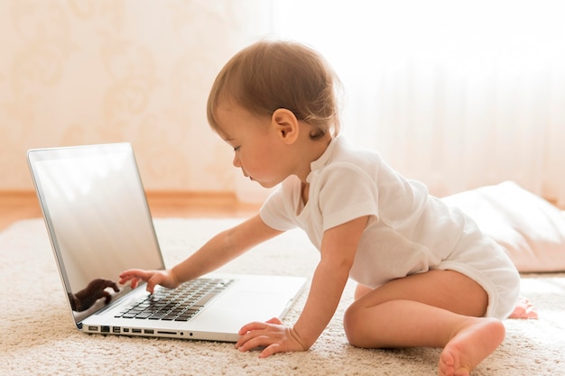 Cute baby and laptop