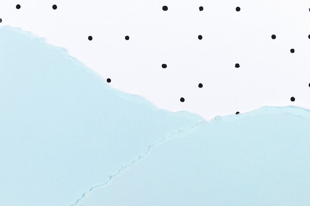 Cute background with blue paper collage and polka dot pattern