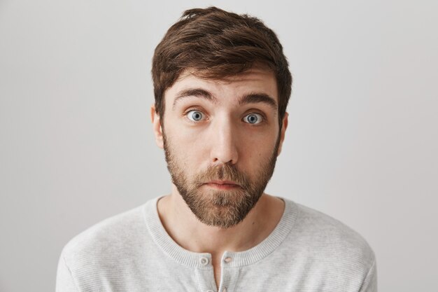 Cute bearded guy looking with puppy eyes