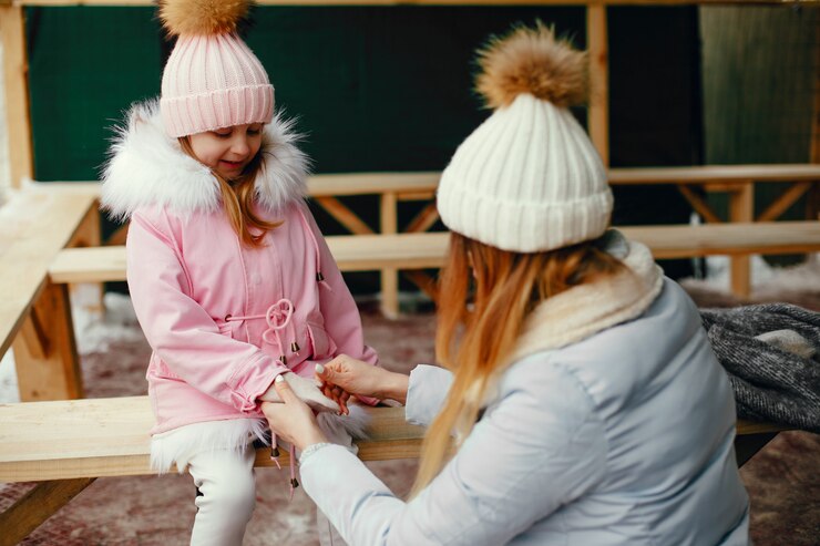 Free Photo cute and beautiful family in a winter city