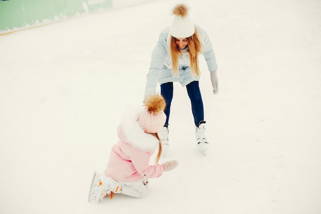 Cute and beautiful family in a winter city