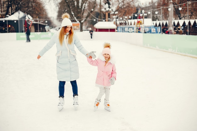 Cute and beautiful family in a winter city
