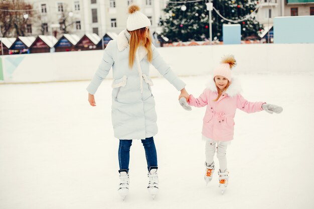 Cute and beautiful family in a winter city