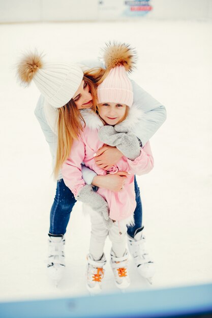 Cute and beautiful family in a winter city