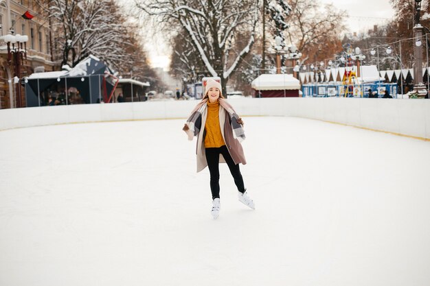 Cute and beautiful girl in a winter city