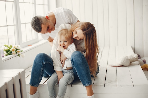 Cute and big family sitting at home