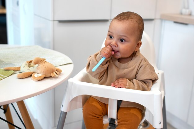 Cute black baby having fun at home