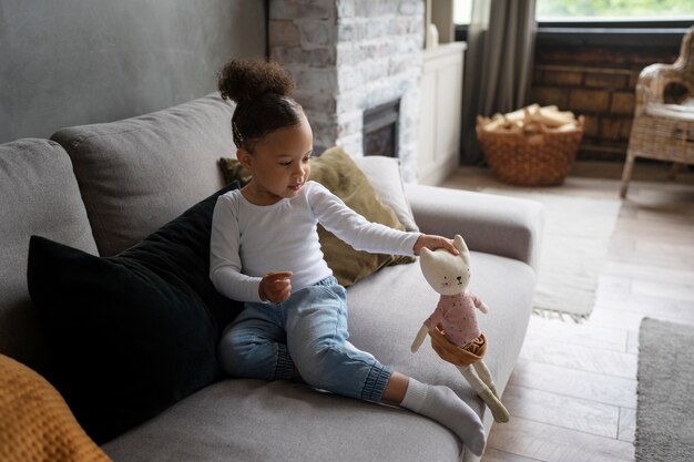 Cute black baby having fun at home