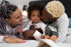 Free photo cute black baby at home with parents