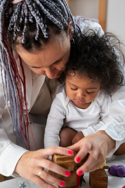 Cute black baby at home with parents