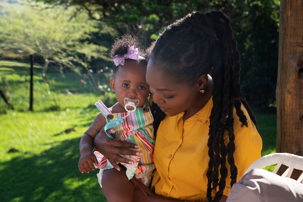 Cute black baby at home with parents