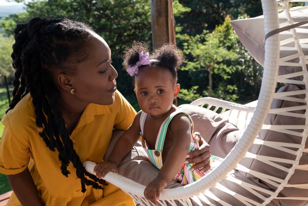 Cute black baby at home with parents