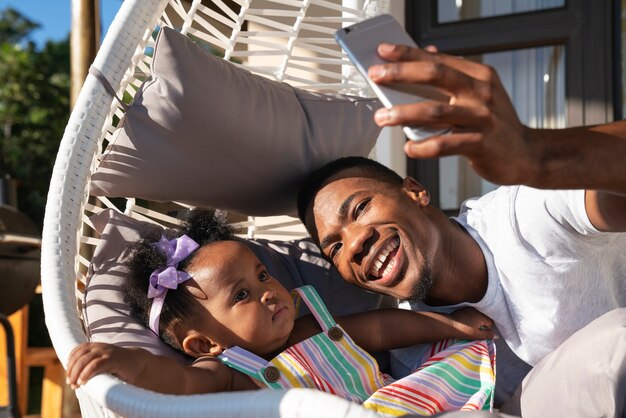 Cute black baby at home with parents