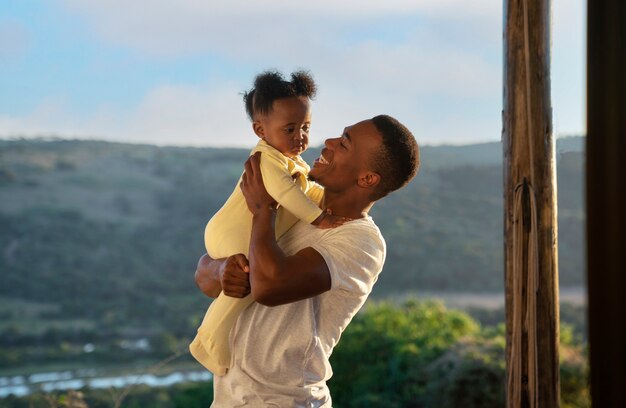 Cute black baby at home with parents