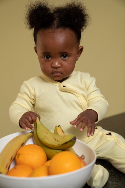 Free photo cute black baby portrait at home