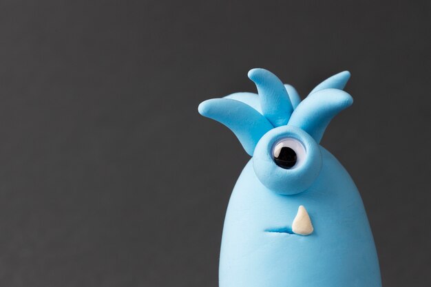 cute blue play dough monster with one eye