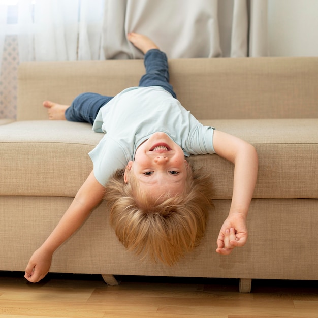 Free photo cute boy on couch