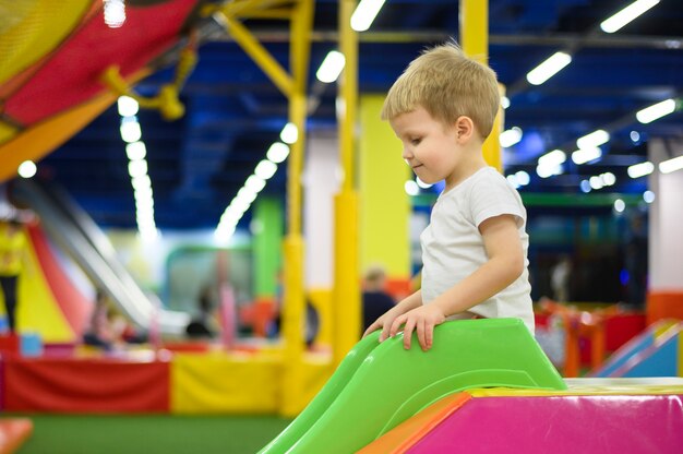 Cute boy on a slide