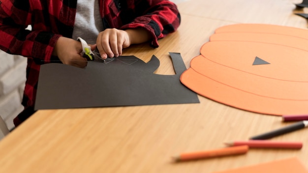 Free photo cute boy with halloween pumpkin concept