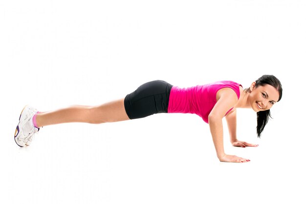 Cute brunette woman during fitness exercise