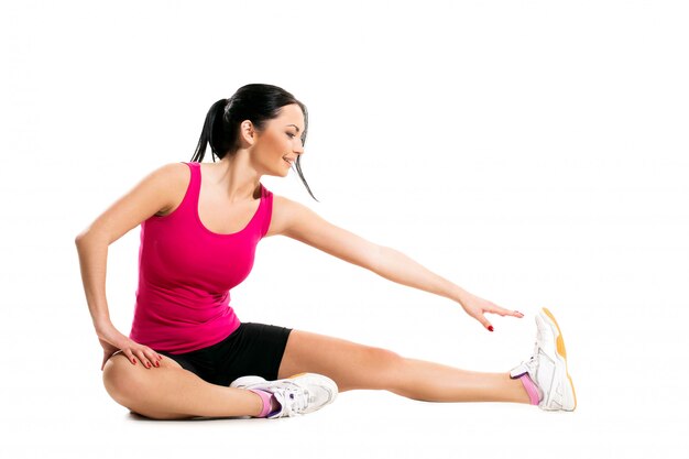 Cute brunette woman during fitness exercise