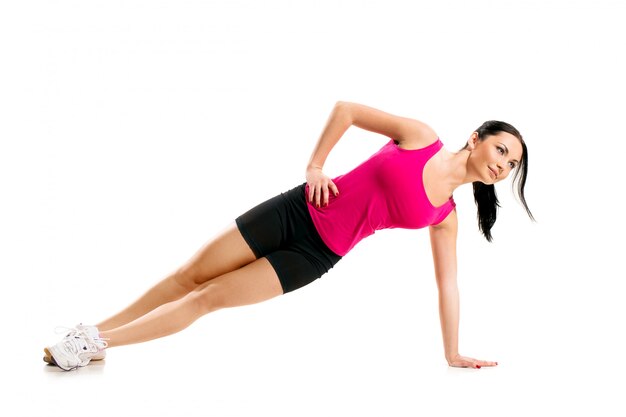 Cute brunette woman during fitness exercise