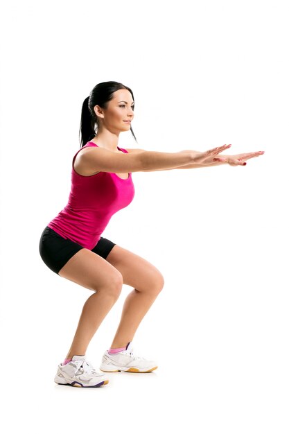 Cute brunette woman during fitness exercise