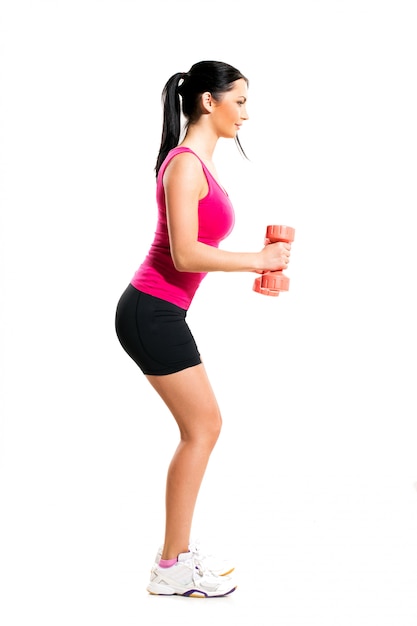 Cute brunette woman during fitness exercise