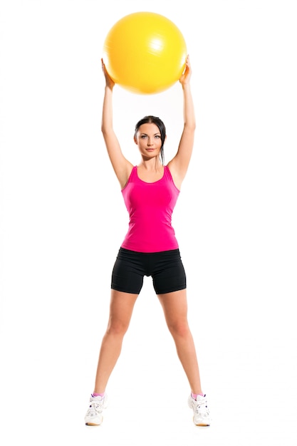 Cute brunette woman during fitness exercise